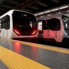 Due treni moderni fermi in banchina alla metropolitana Laurentina, pronti a partire.